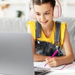 happy Queen's online school girl studying